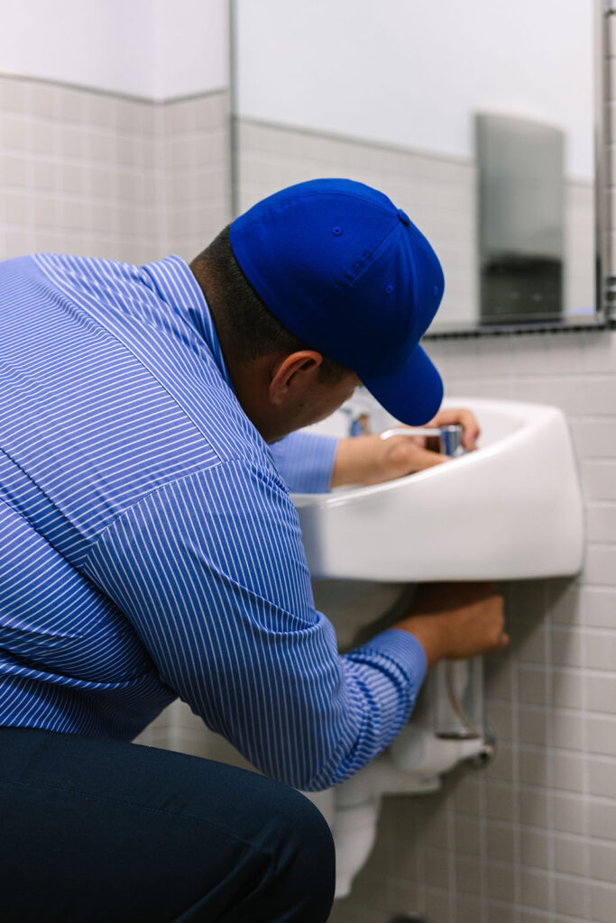 Al Coronado plumber repairing a sink