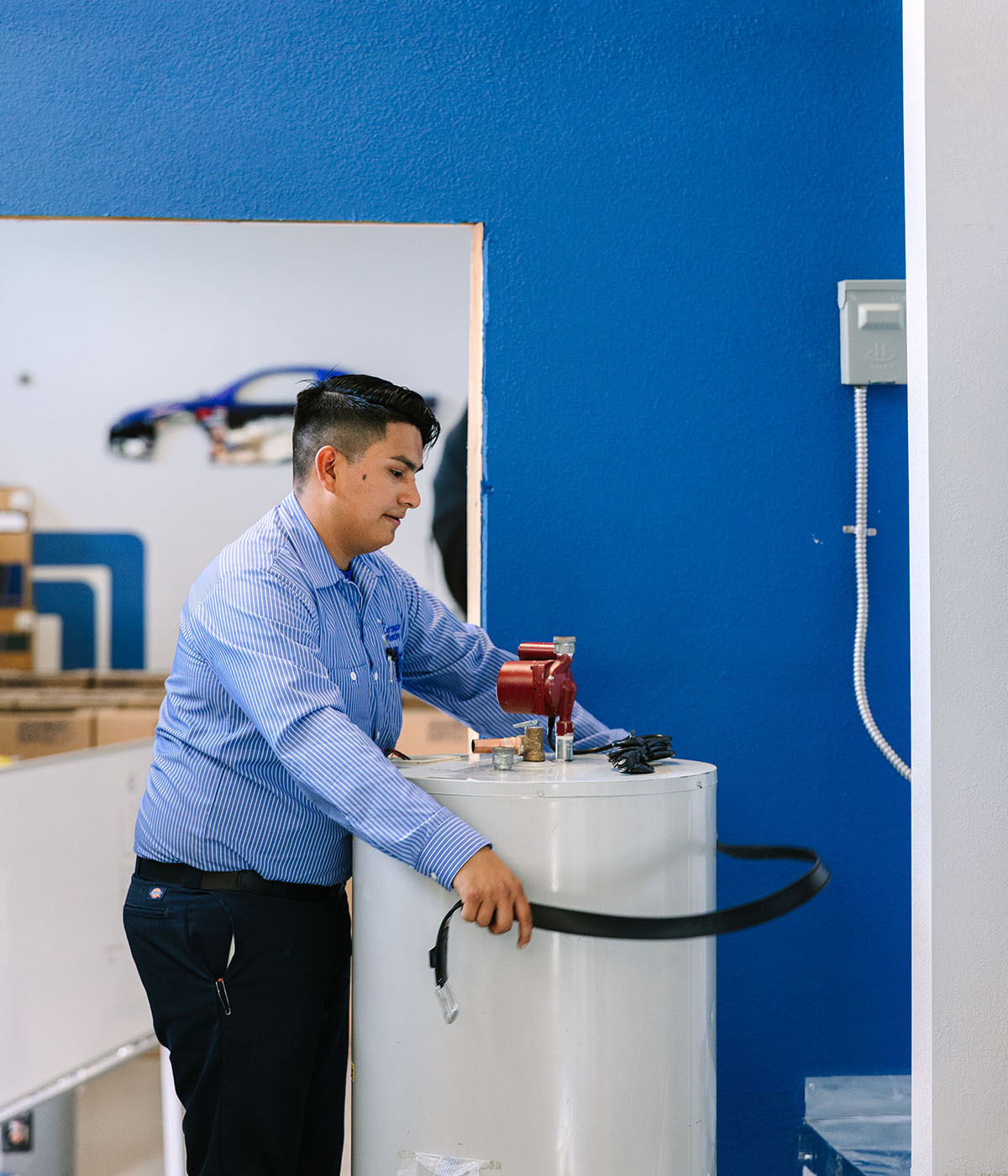 Al Coronado technician working on installing a water heater